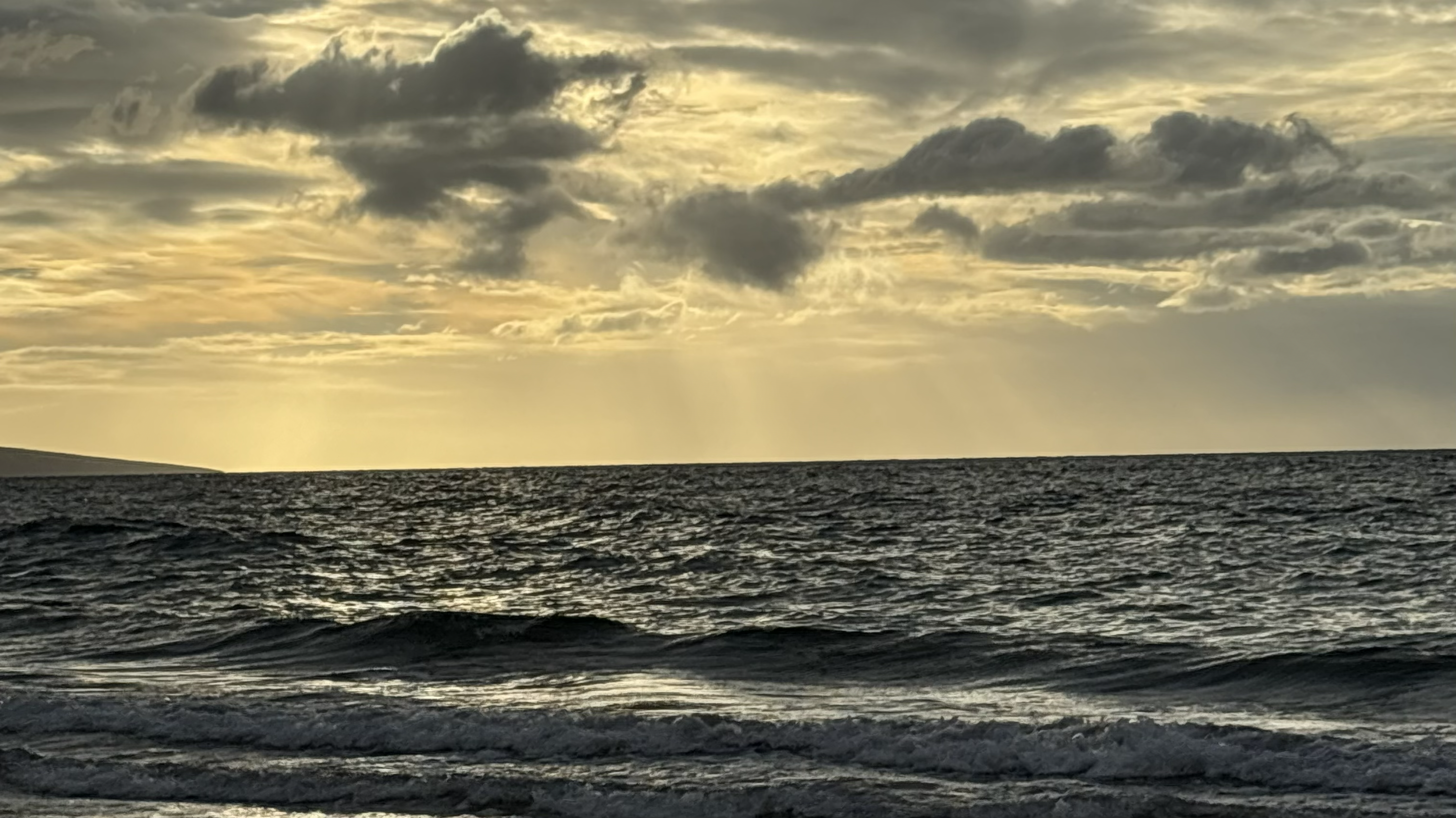 sunset of ocean horizon with a lighthouse