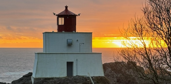 sunset of ocean horizon with a lighthouse